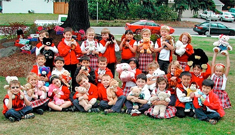 St. Louise School kindergartners show some of the teddy bears they will donate to children in the Bellevue community who face adversity.