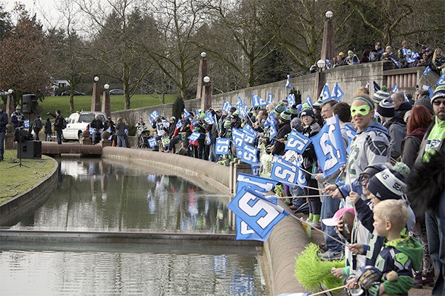 Bellevue's '12th Man' lines the water at Bellevue Downtown Park as the Seattle Seahawks brought music