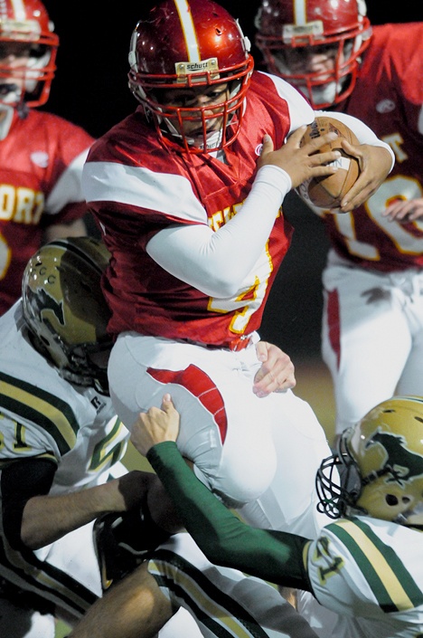 Knights RB Tyler Wright (4) carries against Redmond in the first of two abridged games during three-way tiebreaker play at Lake Washington High School in Kirkland on Tuesday