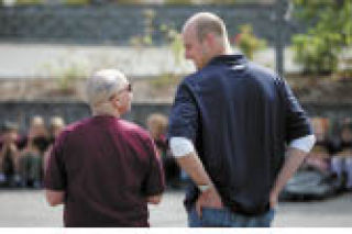 This photo of Seahawks’ quarterback Matt Hasselback chatting with St. Madeleine Sophie School’s teacher Karen Pasqualetto won second place in Best General News Photo - Color.