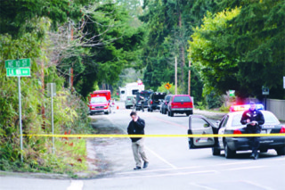 Bellevue Police set up barricades near the 9000 block of Northeast 1st Street as they negotiated with a man who had reportedly barricaded himself in his home and threatened to harm himself.