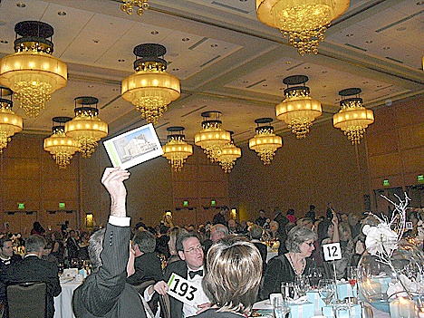 Guests keep the bidding going at the recent candlelight dinner to benefit Performing Arts Center Eastside.