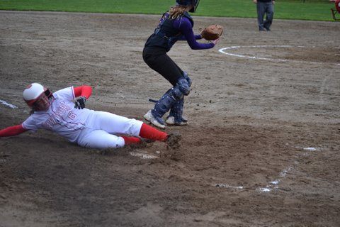 Tommy Tomlinson slides home for a run against Issaquah.