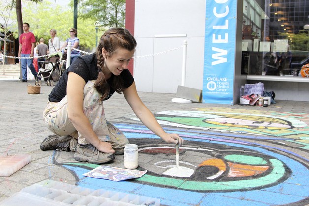 Street painter and chalk artist Gabrielle Abbott works on a piece outside the Bellevue Arts Museum during its annual ARTSfair July 28.