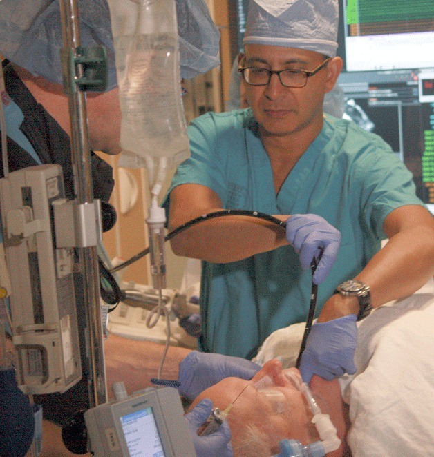 Dr. Derek Rodrigues prepares a patient for an atrial fibrillation ablation procedure at Overlake Hospital Medical Center. The operation creates lesions inside that block the path of “an electrical storm” of signals from the pulmonary vein