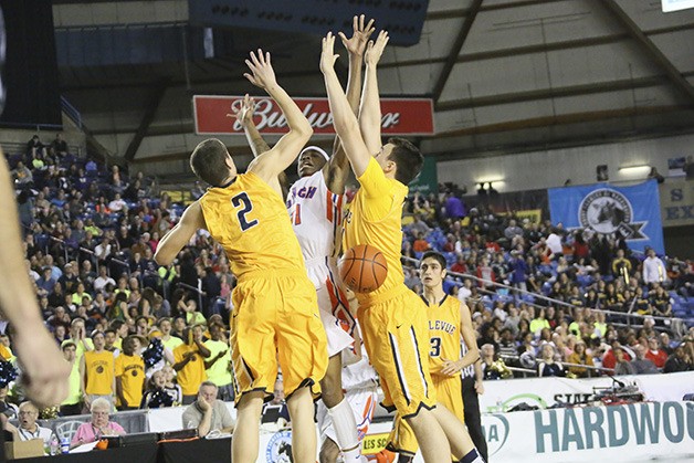 Bellevue's Gunther Klimes (2) and Jack Walton harass a Rainier Beach player