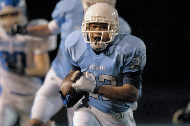 Saints RB Jordan Todd (22) breaks free for first quarter touchdown run against North Mason at Interlake on Tuesday.