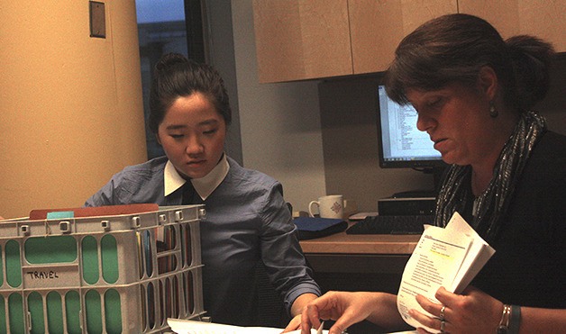 Interlake High School senior Charlene Kwon helps Bellevue Mayor Claudia Balducci file documents at City Hall on Monday