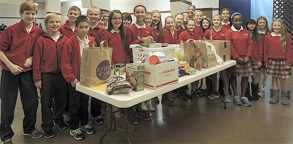 Students at the St. Louise School put together and delivered 18 complete Thanksgiving baskets for families in need.