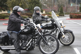 Doug Davis and Clive Brazg prepare to take off from a Factoria parking lot for their monthly ride with The Tribe