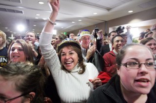 Martha Burgess of Fox Island cheers as Dino Rossi takes the stage Tuesday night at a Republican Party election night party at the Hyatt Regency hotel in Bellevue.
