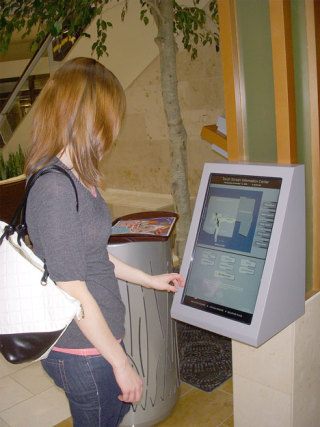 A shopper checks out a new touch screen directory of stores at The Bellevue Collection.
