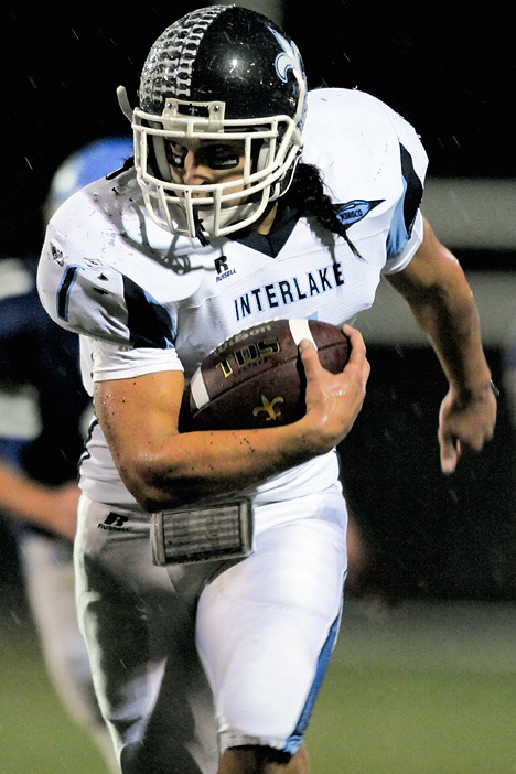 Saints RB Brett Kirschner breaks loose for a gain against North Mason during a 2A playoff game at Curtis High School in Tacoma on Tuesday.