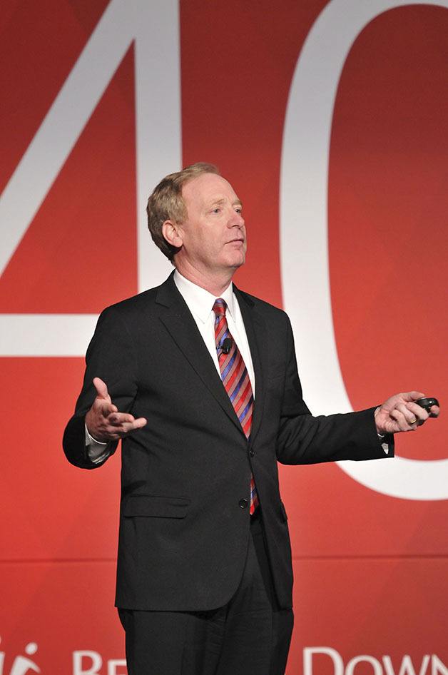Microsoft executive vice president Brad Smith speaks before a crowd at the Bellevue Downtown Association's 40th Anniversary celebration dinner at the Meydenbauer Center on Thursday