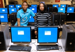 Jamaican teachers Jean Manning and Ramon Bremmer visit Tyee Middle School to learn about technology in the classroom.