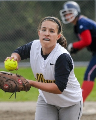 Bellevue pitcher Emily Fleischman unleashes a pitch during Wednesday's game as a Juanita runner stands at second base in the background. Juanita won 14-0.