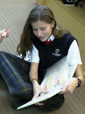 Emerald Heights academy eighth grader Helen Haley read to students of the Jennifer Rosen Meade preschool in October.