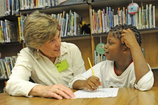 VIBES volunteer Carol Orr works with Emeri.