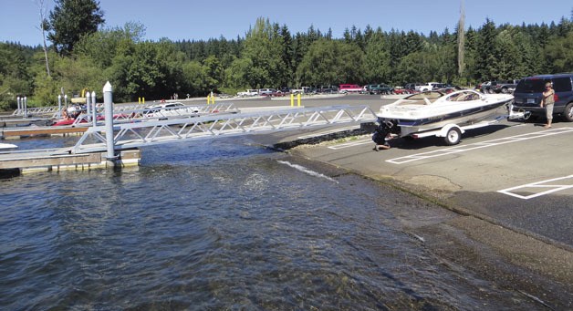 A boater prepares to launch at the newly refurbished public launch at Lake Sammamish State Park on Monday July 15.