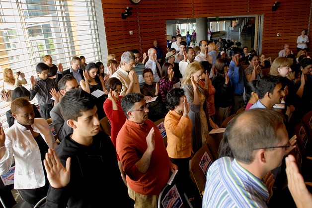Fifty-one people from 23 countries became citizens of the United States during a naturalization ceremony held at City Hall in Bellevue on Friday.
