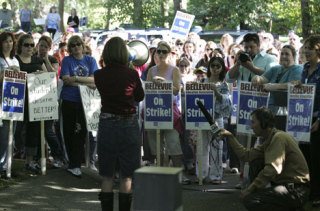 Bellevue Education Association president Michelle Miller talks to teachers who gathered at the Bellevue School District headquarters Tuesday