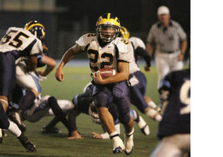 Bellevue junior running back Will Fields rumbles towards the end zone in Bellevue’s 56-14 victory over Interlake. Fields rushed for 157 yards and three scores in the win.