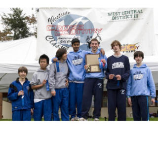 The Interlake boys cross country team celebrates their district title. The team