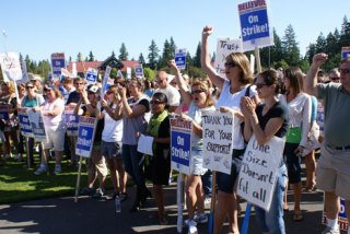 Teachers rallied at Bellevue's Crossroads Park on Friday