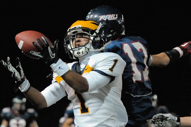 Wolverine DB Tyler Hasty (1) makes an interception late in the fourth quarter to seal a 21-14 Bellevue victory at Juanita on Friday.