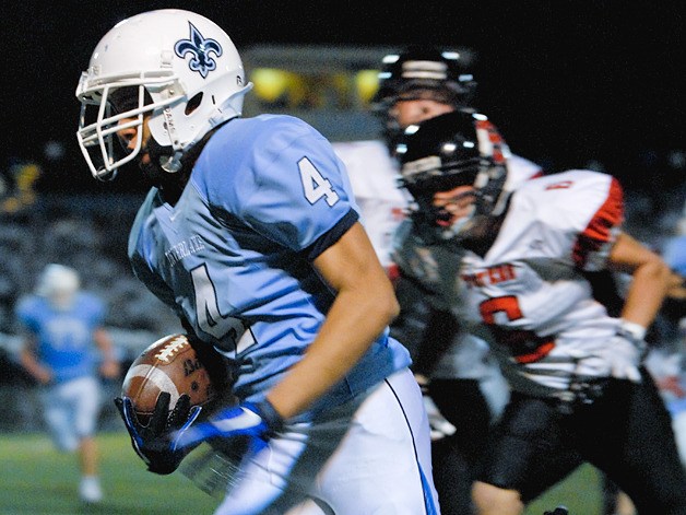 Saints WR Ryan Turman (4) races to the endzone for a first quarter touchdown against Sammamish at Interlake on Friday. Interlake won the annual Crossroads Cup 41-14.