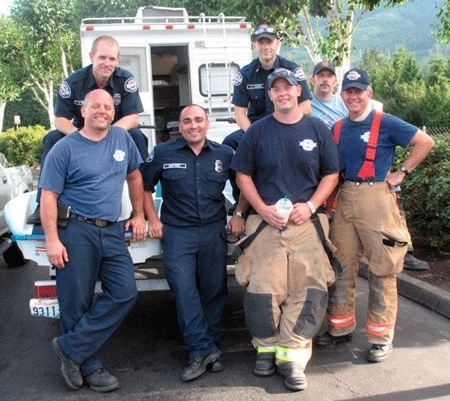 Eastside Fire and Rescue members volunteer to collect money for MDA. EFR Fire Fighters: (top row) Steve Williams