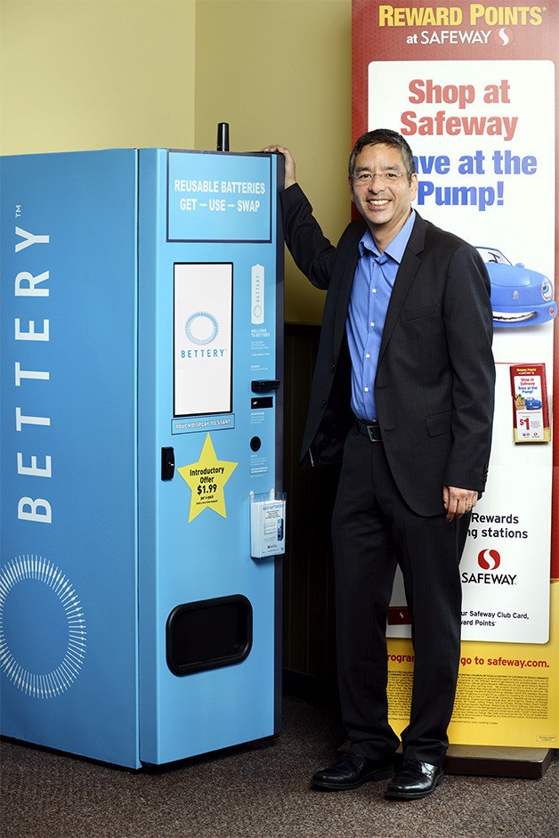 BETTERY CEO Charlie Kawasaki stands next to one of his company's high-tech rechargeable battery exchange and alkaline battery recycling kiosks in Kirkland on Wednesday