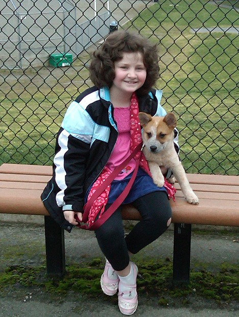 Rachel Cantwell sits with her dog