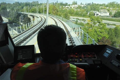 A light rail conductor drives northbound from Tukwila Station during a demonstration of Sound Transit's Link light rail project in 2008.