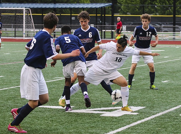 Interlake Saints leading goal scorer Jason Rodriguez is surrounded by a bevy of Kennedy defenders in the Class 3A state quarterfinals on May 23 in Bellevue. The Saints defeated Kennedy 2-0 with a berth in the Class 3A state semifinals on the line.