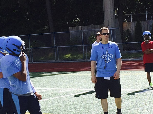 Interlake new head football coach Brian Hartline offers words of encouragement to his players during a spring football practice session on June 20 at Interlake High School in Bellevue.