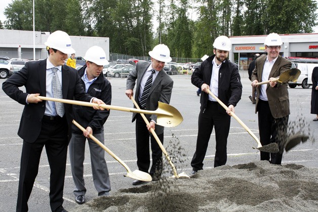 Left to right - Brian Franklin (PMF Investments) Michael Chen (Group Mackenzie) Nat Franklin (PMF Investments) Jason Carey (Barghausen Consulting) John Chelminiak (Bellevue City Council) celebrate the beginning of construction at the Kelsey Creek Shopping Center Thursday morning.