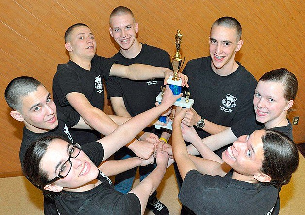 Civil Air Patrol’s Overlake Squadron color guard shows off the top award won at the state wing’s cadet competition at Camp Murray