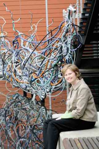 Art Specialist Mary Pat Bryne praises the work of artist Dan Corson for his recent installation of his piece called the Longboat-Reed-Rookery.