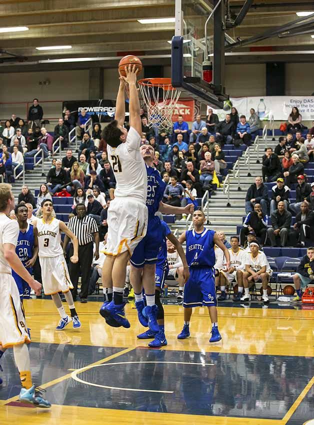 Bellevue's Jack Walton throws down a dunk against Seattle Prep.