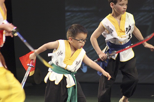 Students of the Seattle Shaolin Kungfu Academy demonstrate their skills on stage at Newport High School.