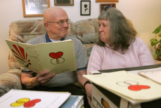 Joe and Helen Hesketh smile at each other after reading one of the love letters that Joe wrote.