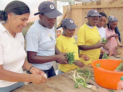 Orphans in Haiti work together to prepare food.