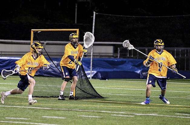 Bellevue defenders Chris Medzegian (right) and Andrew Choe have helped senior goalkeeper Cole Cansler make the most of his first season as the varsity starter in the cage