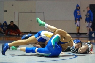 Davis Jones of Bellevue looks to pin Liberty's Hamilton Noel in Saturday's KingCo 3A wrestling championships. Jones won 12-10 in the 135-pound class.