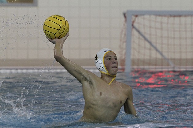 Bellevue Wolverines water polo player AJ Rossman throws a pass to a teammate during his freshman season. The Bellevue water polo team is striving to repeat as state champions.
