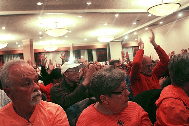 Concerned residents from Renton to Redmond attended the final community advisory group meeting for Puget Sound Energy's Energize Eastside project. The Coalition of Eastside Neighborhoods for Sensible Energy and its supporters wore orange shirts.