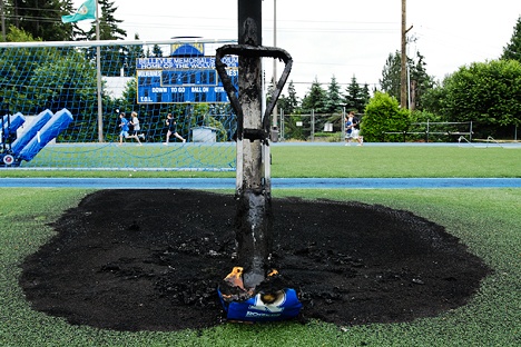 A suspected arson fire damaged the goal post and turf at Bellevue High School's football field on Wednesday.
