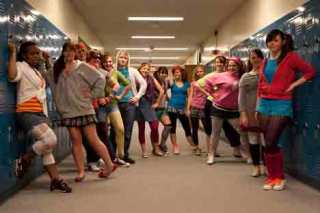 Castmembers from the Bellevue High School production of 'Footloose' pose in the school hallway.