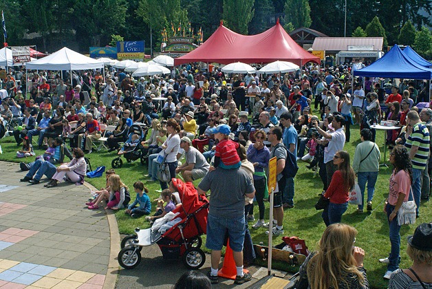An attentive crowd listens to music at Bellevue's Strawberry Festival on June 24. The event